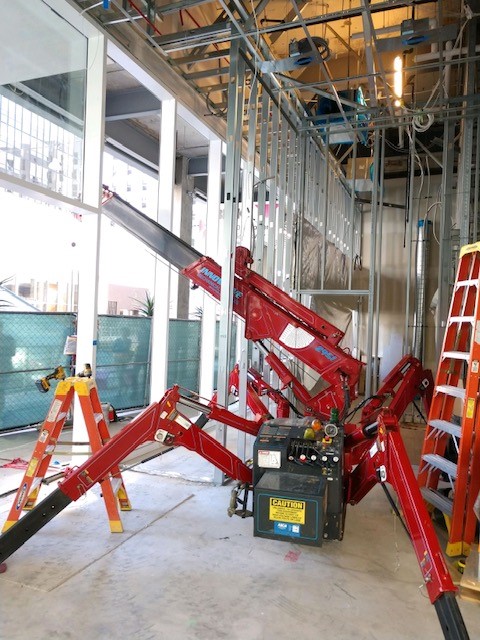 SPYDERCRANE lifting and placing heavy objects in confined space.